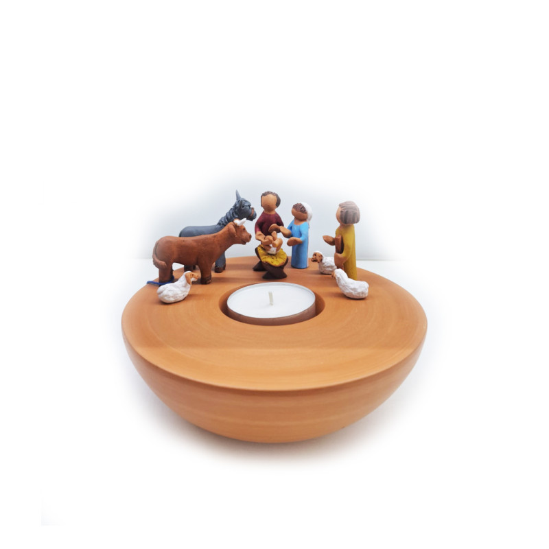 Nativity scene with a candle