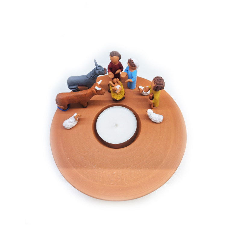 Nativity scene with a candle