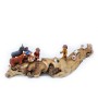Nativity scene in a wooden log